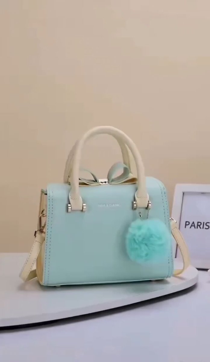 A cinematic luxury handbag commercial featuring an elegant designer…