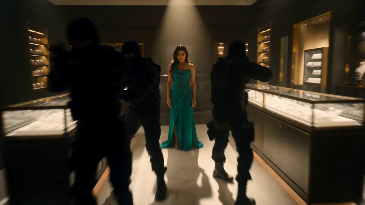 A dynamic, cinematic action sequence inside a luxury jewelry…